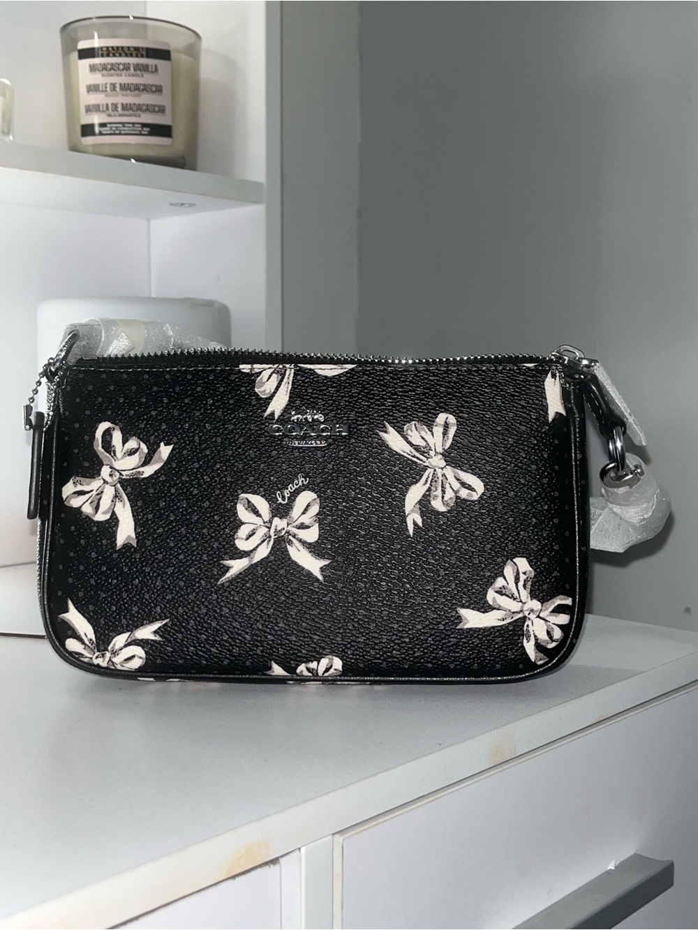 Coach Black Wristlet with White Bow Print